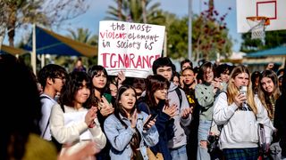 Students at Great Oak High School in Temecula, Calif., walk off campus Friday, Dec. 16, 2022, in protest of their district's ban on critical race theory curriculum.